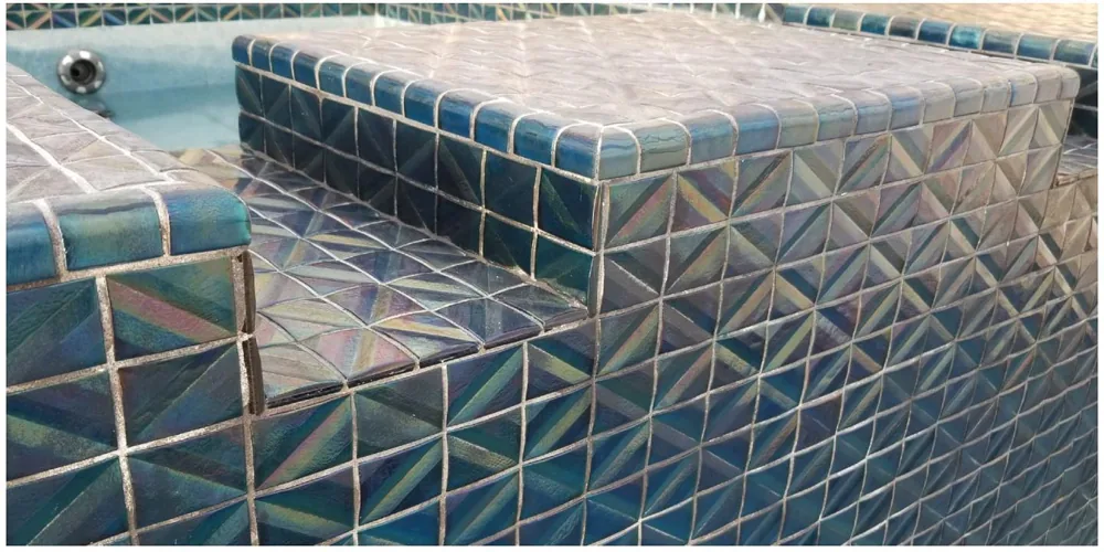 After: crystal-clear iridescent diamond-pattern pool tile