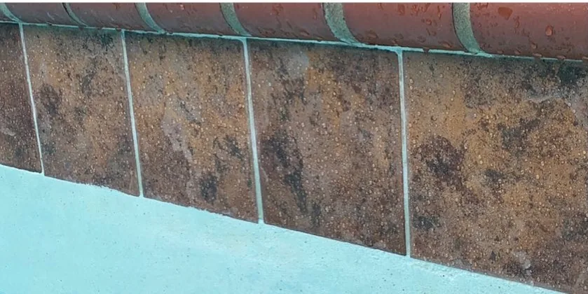 After: clear, restored rust-toned stone-look tile