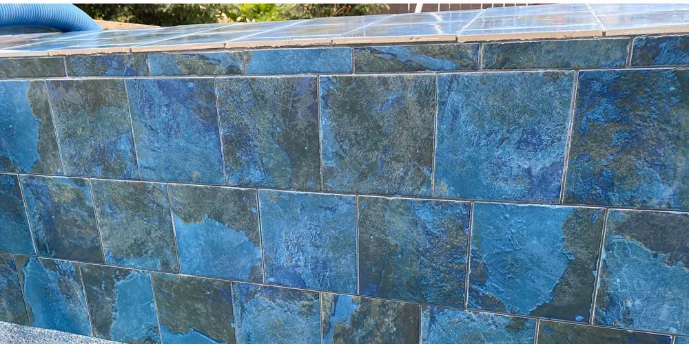 After: vivid blue slate-look pool tile