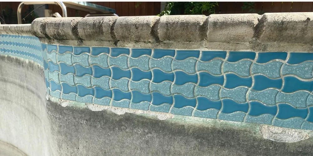 After: clean, vivid turquoise wave-pattern tile