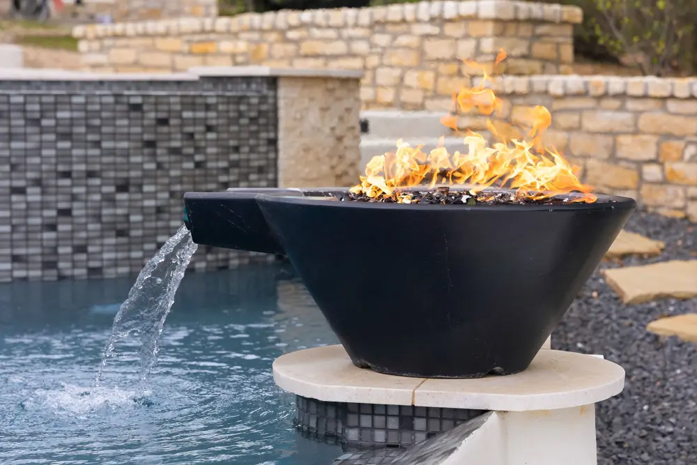 Dual fire bowl water features at a fully serviced infinity pool