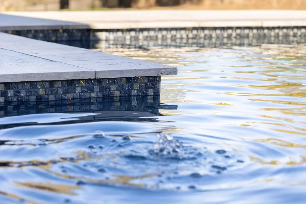 Smooth pool edge detail after fiberglass surface repair