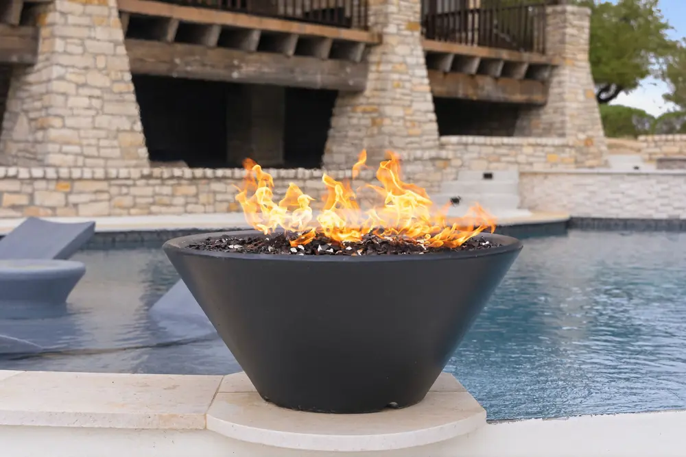Fire bowl and pool edge at a Hill Country home near Spring Branch