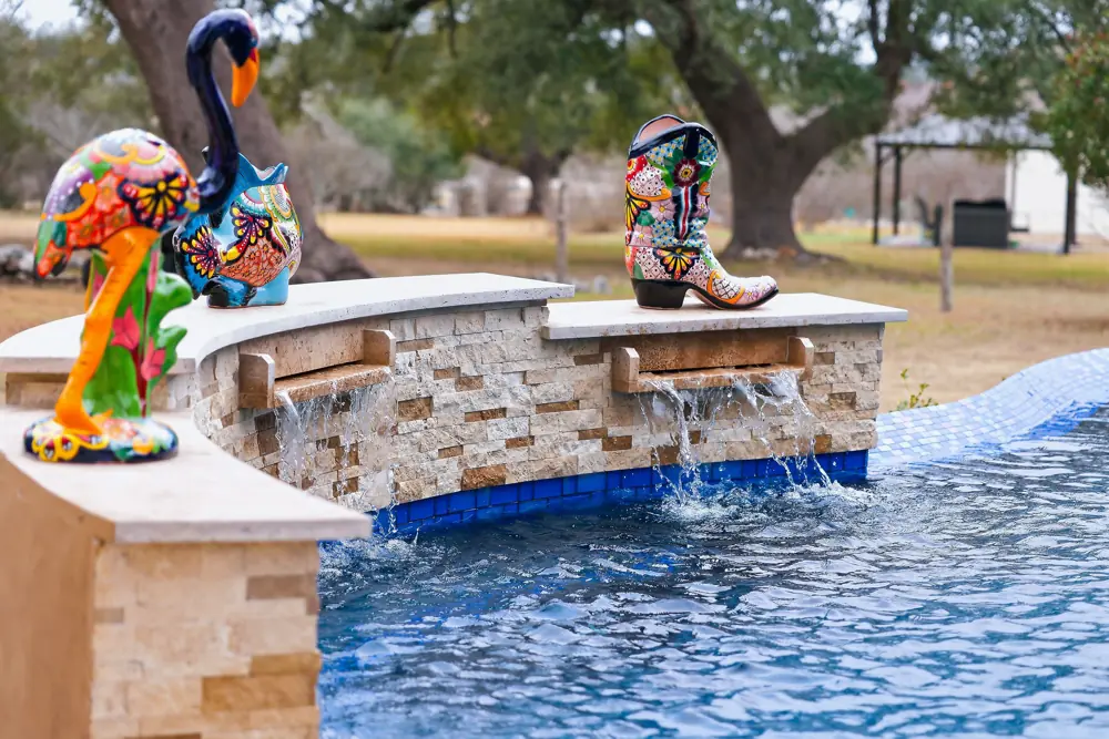 Decorative tile and stone accents at a well-maintained pool