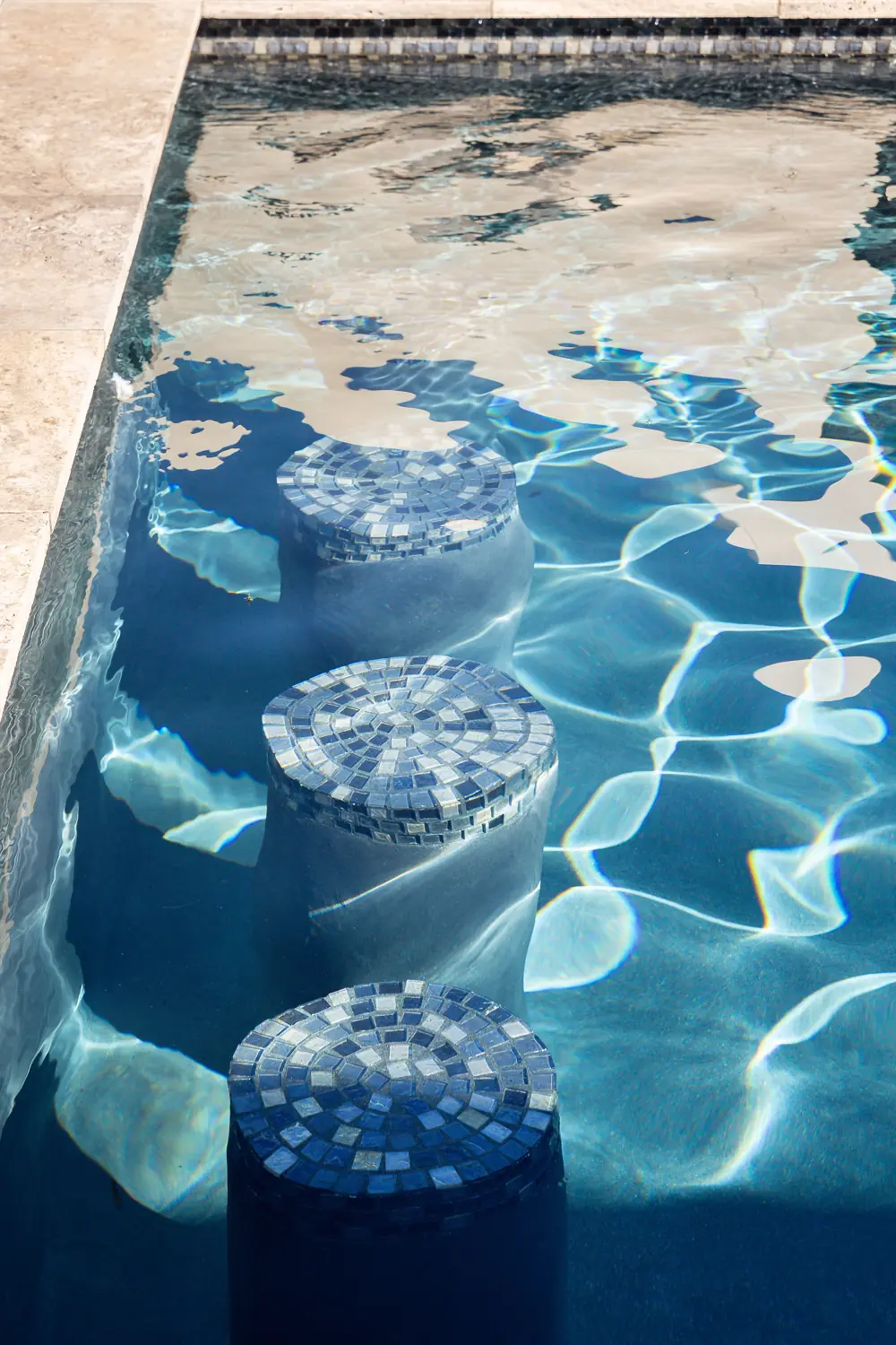 Close-up of clean blue mosaic waterline tile