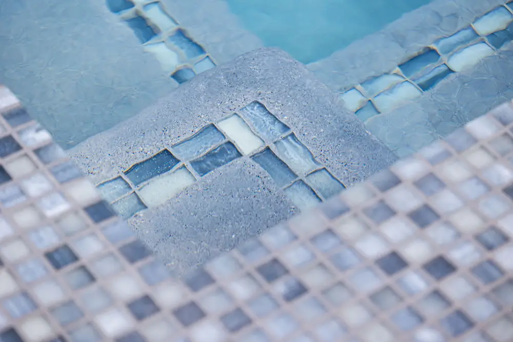 Close-up of a pool tile step