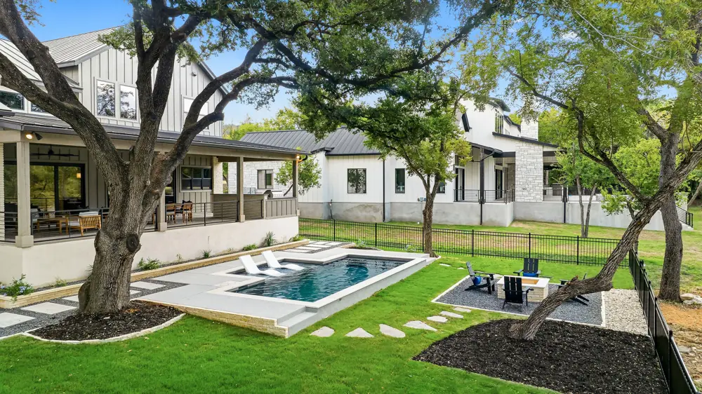 Renovated pool and fire pit area at a Hill Country home near San Antonio