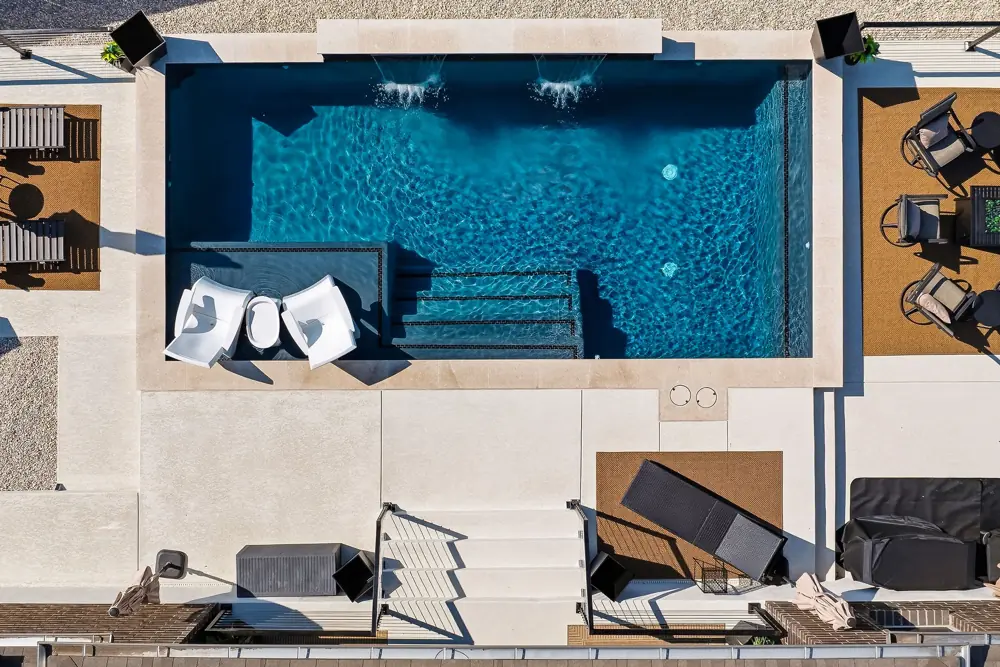 Aerial view of a repaired rectangular pool with loungers