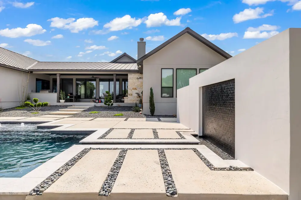 Modern pool with a repaired water wall feature