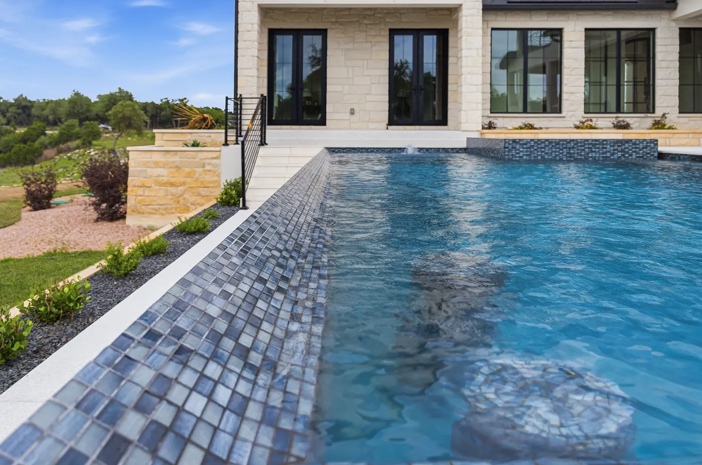 Pool waterline and tile edge where unexplained water loss is diagnosed