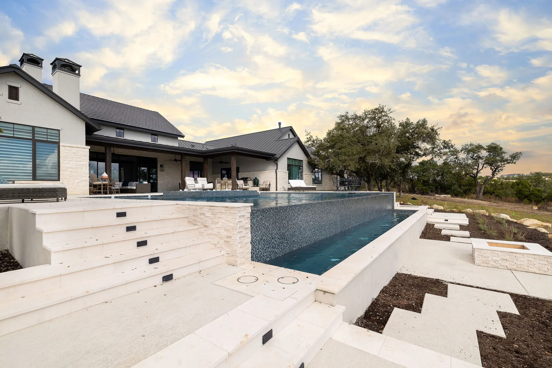 Infinity-edge pool at a modern stone home near Boerne