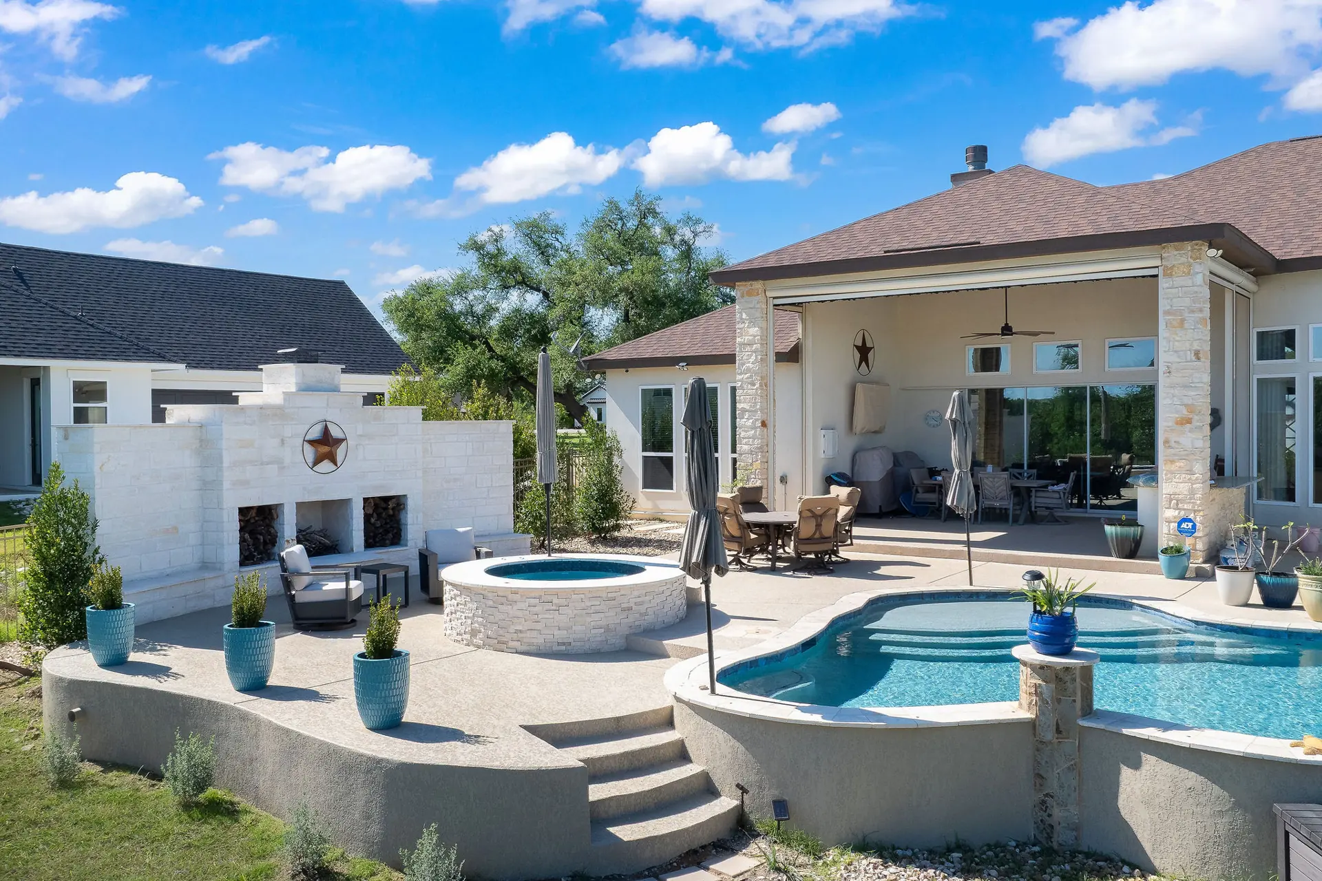 Modern courtyard pool with a water wall feature near Buda