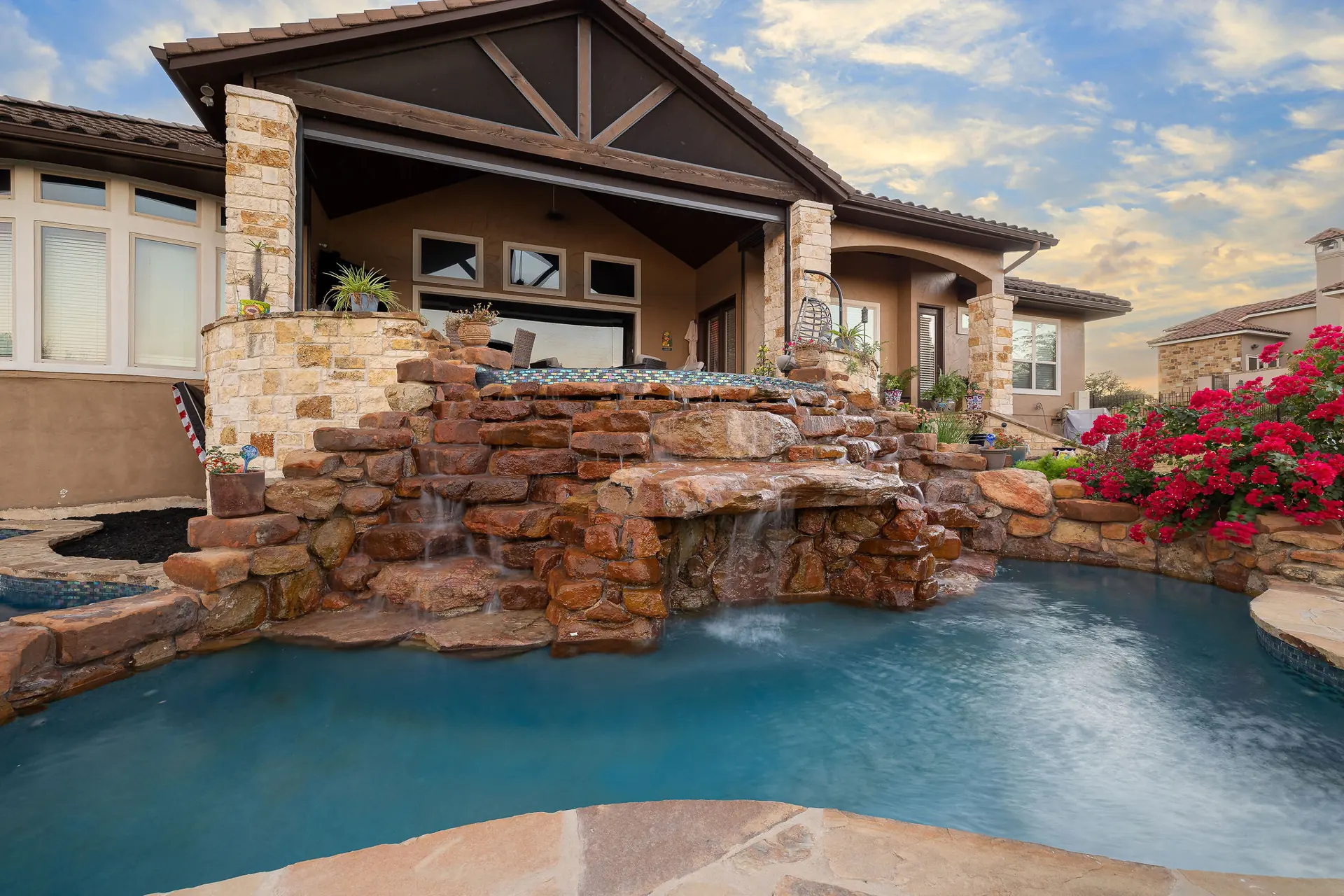 Rock waterfall grotto pool at a Hill Country home near Bulverde