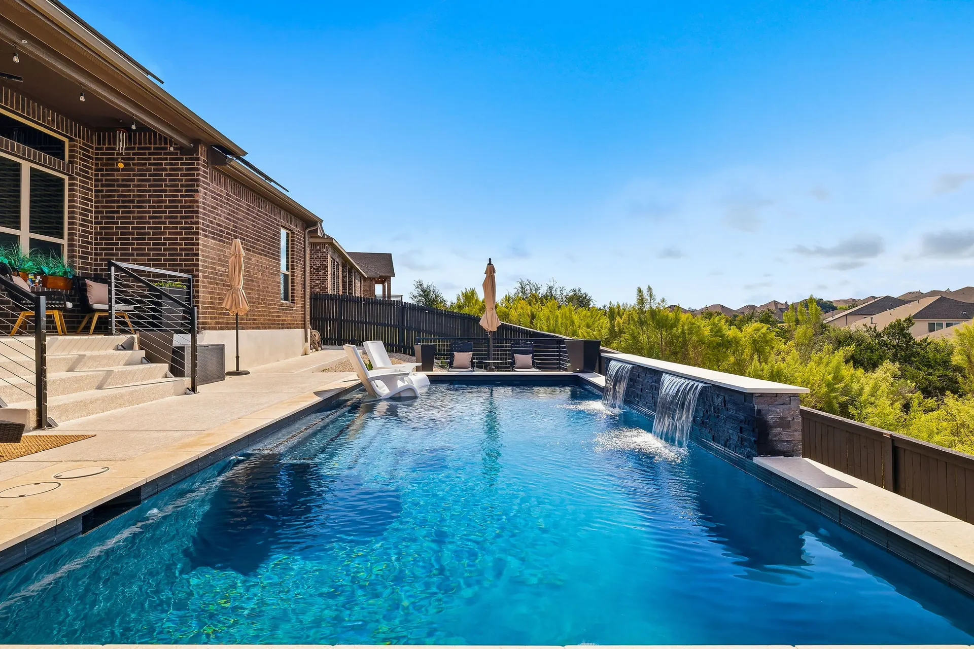 Dual waterfall spillway pool at a home near Comfort