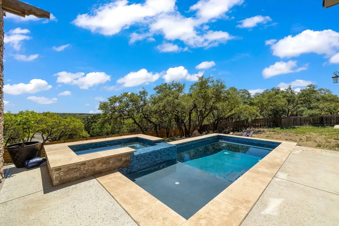 Backyard pool with serviced equipment and Hill Country trees